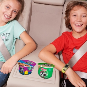 Kids can take Raisin Bran Crunch and Apple Jacks cereal cups as snacks on the go in a car or SUV