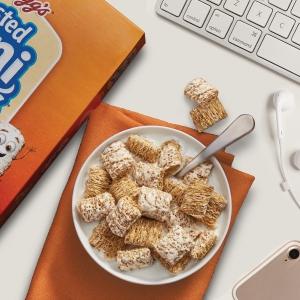 Start your morning with a bowl of Frosted Mini Wheats at your work desk by your computer and phone